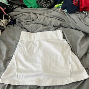 Athletic skirt with zipper and built in shorts